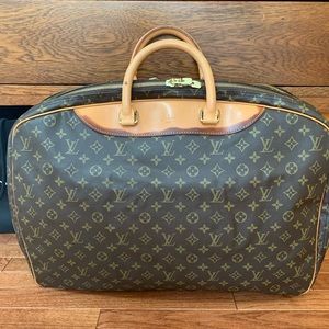 Louis Vuitton Alize 2 Poches Travel Bag